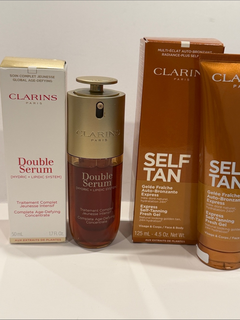Clarins Double Serum & Self Tan Set — Gold, White, Bronze